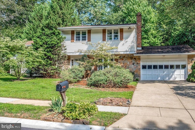 traditional-style home with a garage, stone siding, a chimney, and concrete driveway