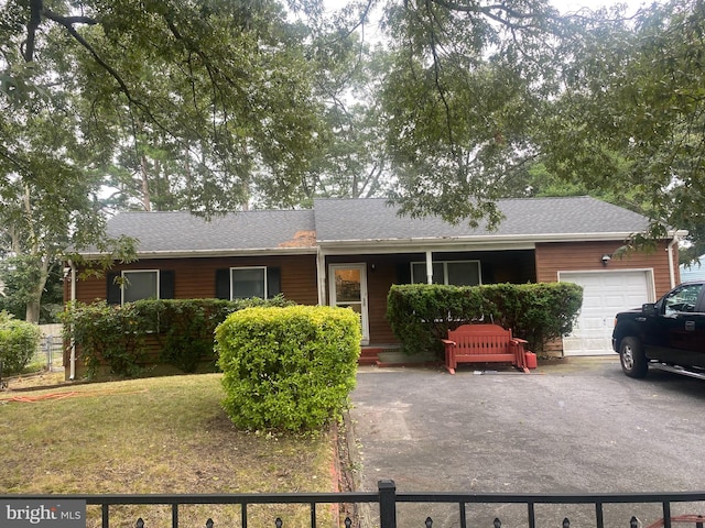 single story home with a garage