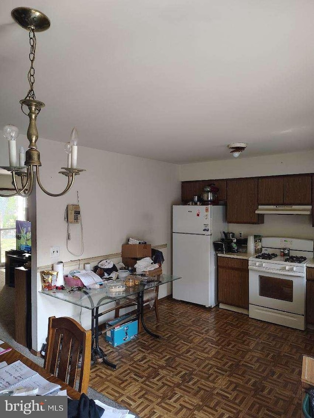 kitchen featuring dark parquet floors, white appliances, ventilation hood, a notable chandelier, and dark brown cabinets