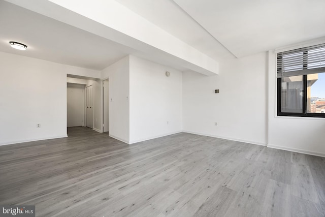 spare room featuring light hardwood / wood-style floors