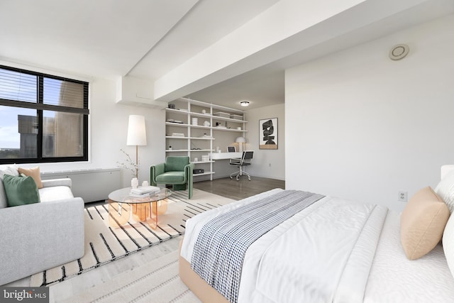 bedroom with wood finished floors