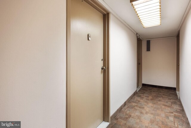 corridor featuring hardwood / wood-style flooring