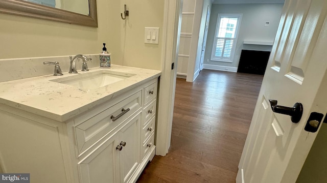 bathroom with vanity and hardwood / wood-style flooring