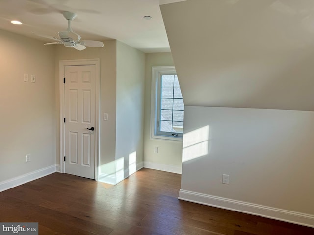 unfurnished room with dark wood-type flooring and ceiling fan