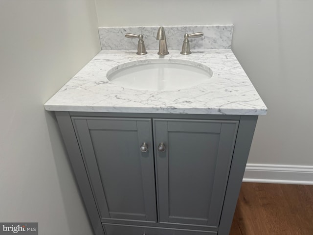 interior details with hardwood / wood-style floors and vanity