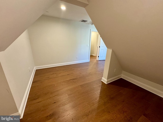 bonus room featuring vaulted ceiling and hardwood / wood-style flooring