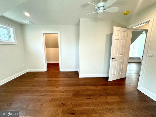 unfurnished room with dark hardwood / wood-style flooring and ceiling fan