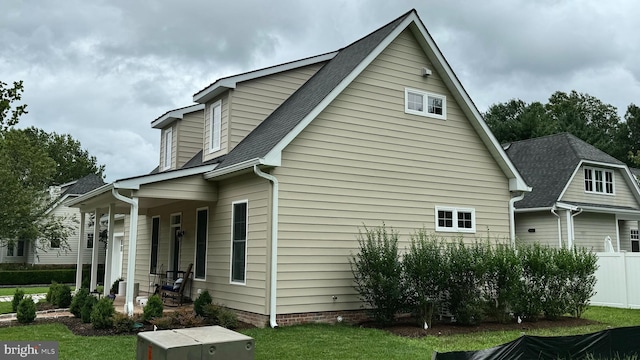 view of home's exterior with a yard