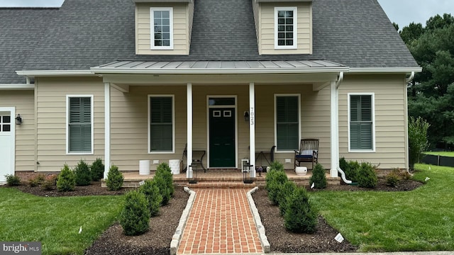 view of front of home featuring a front lawn and a porch