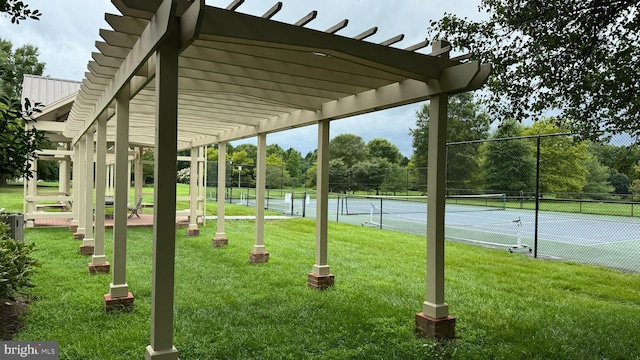 surrounding community with tennis court, a pergola, and a lawn