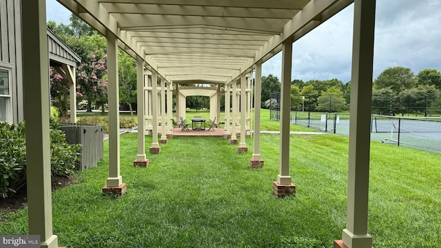 view of yard with tennis court