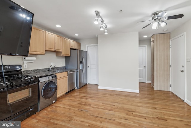 kitchen with light brown cabinetry, washer / clothes dryer, light wood-style flooring, and appliances with stainless steel finishes