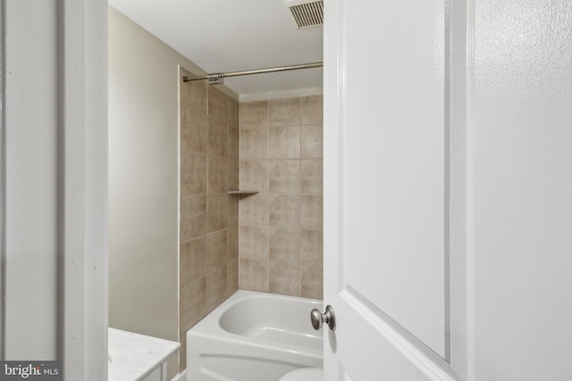 full bathroom featuring toilet,  shower combination, vanity, and visible vents