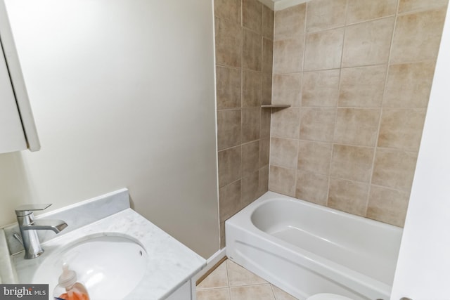 bathroom with bathtub / shower combination, vanity, and tile patterned floors