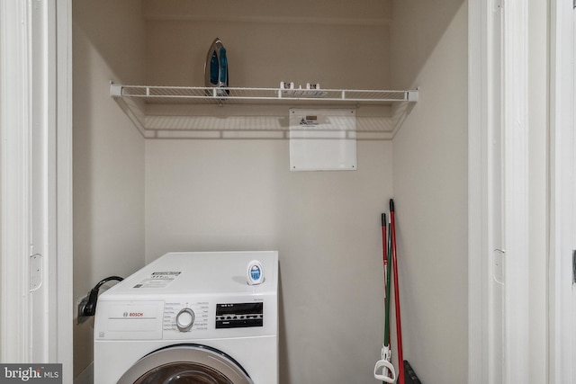 laundry room featuring laundry area and washer / clothes dryer