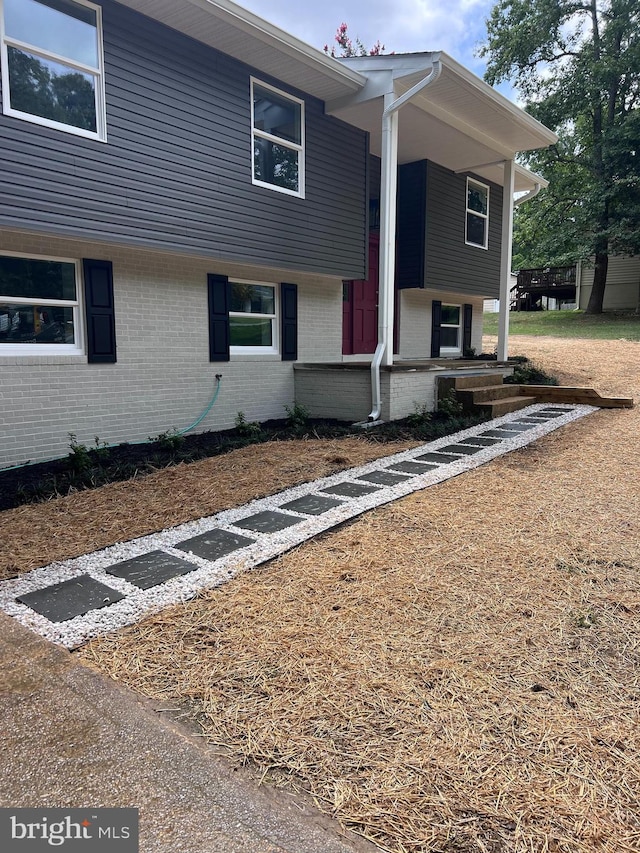 view of front of house featuring brick siding