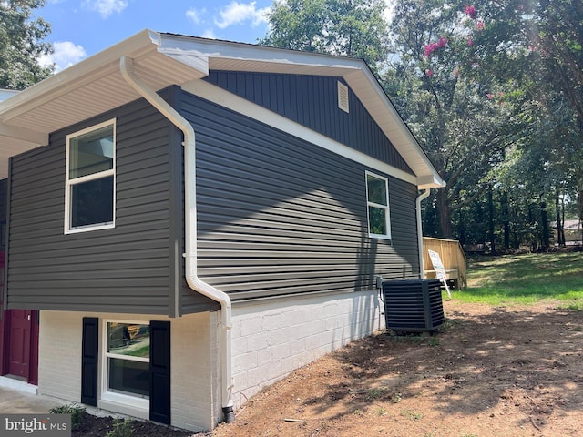 view of side of property with cooling unit