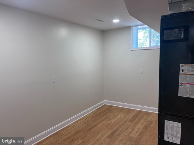 basement featuring wood-type flooring