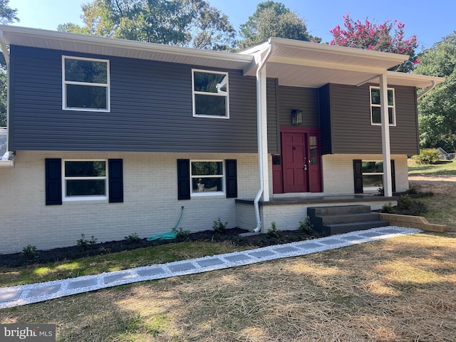 split foyer home with brick siding