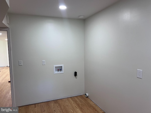 laundry area featuring washer hookup and hardwood / wood-style floors