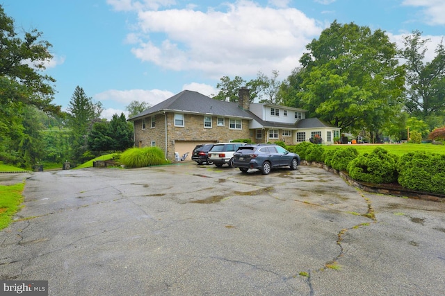 view of parking featuring a garage