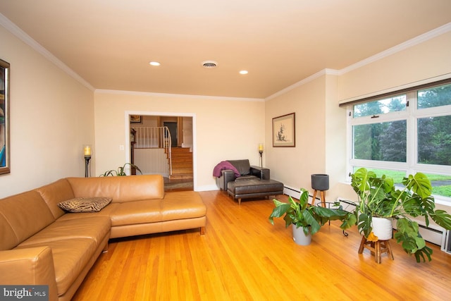 living room with crown molding, hardwood / wood-style flooring, and a baseboard radiator