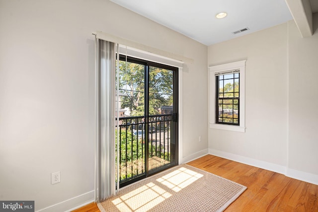 spare room featuring light hardwood / wood-style floors