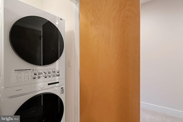 laundry area featuring stacked washer and dryer