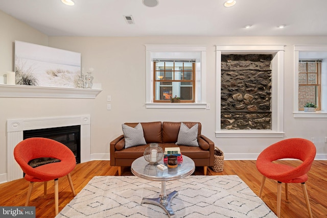 sitting room with hardwood / wood-style floors