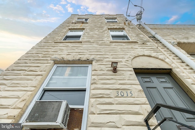 exterior space featuring stone siding