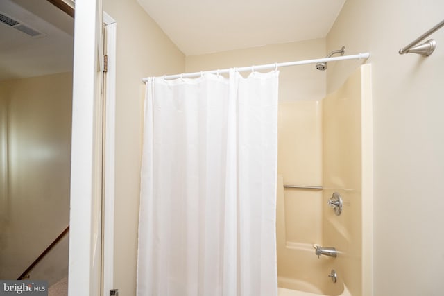 bathroom featuring shower / tub combo with curtain