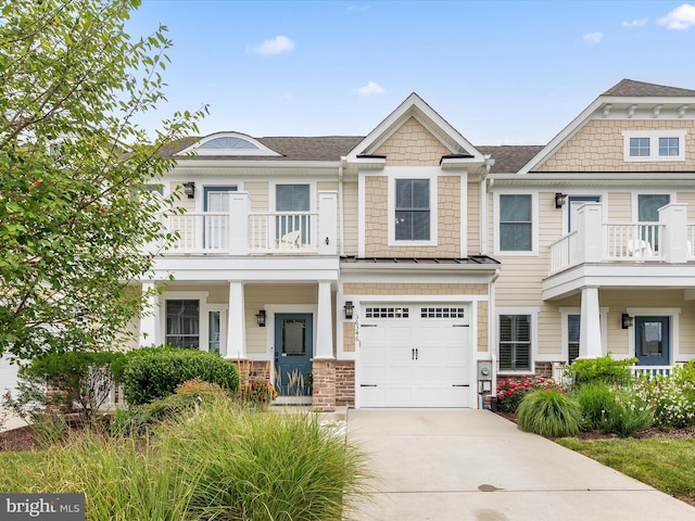 view of front of property with a balcony and a garage