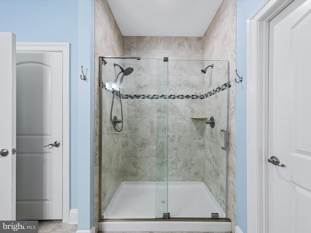 bathroom featuring an enclosed shower