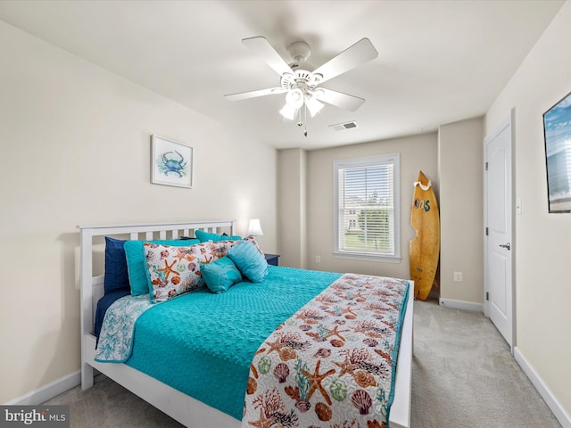 carpeted bedroom featuring ceiling fan