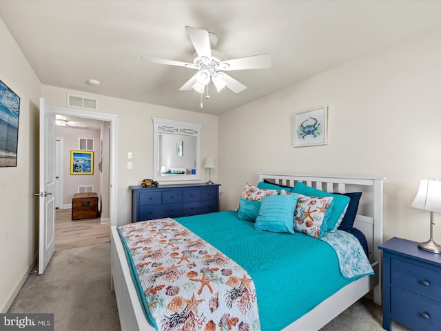 carpeted bedroom with ceiling fan