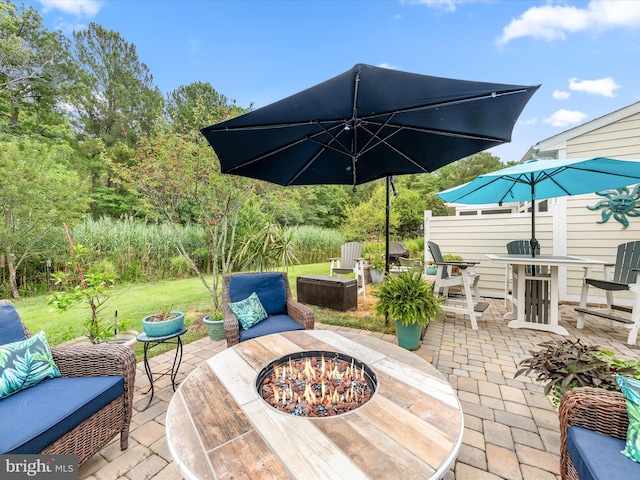 view of patio with a fire pit