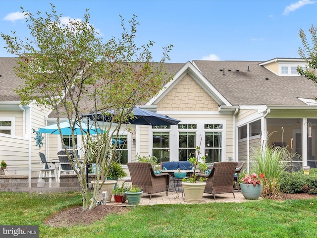 rear view of property with a patio and french doors