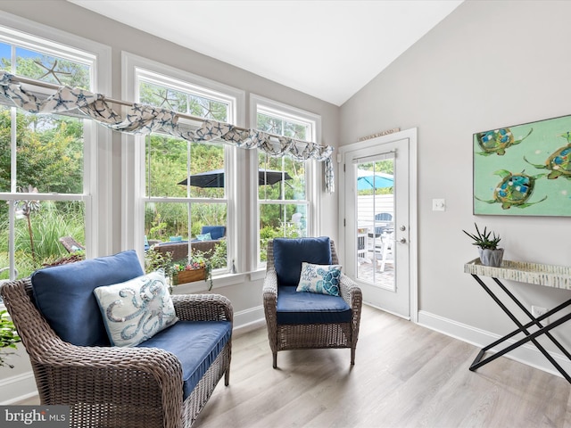 sunroom / solarium with plenty of natural light and vaulted ceiling