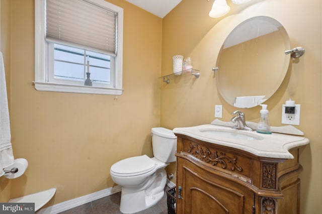 bathroom with vanity, tile patterned floors, and toilet