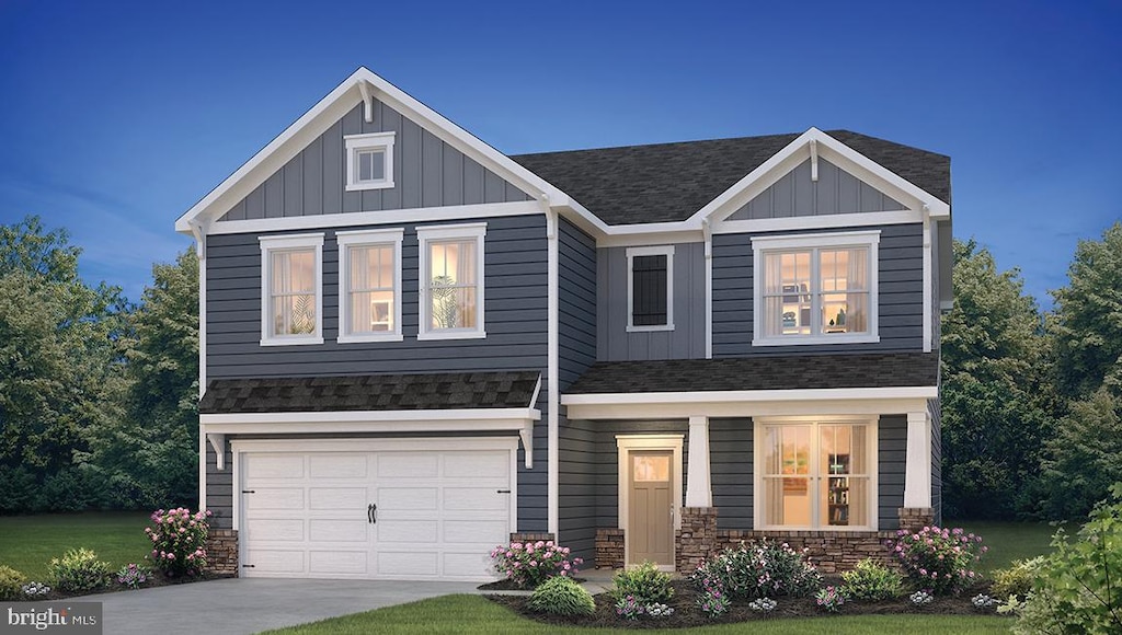 craftsman-style house featuring a garage and a front lawn