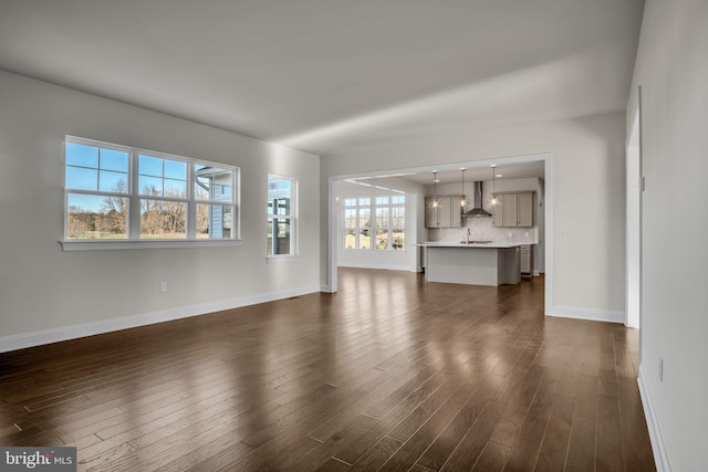 unfurnished living room featuring dark wood-type flooring