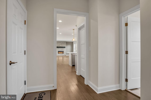 corridor featuring hardwood / wood-style floors