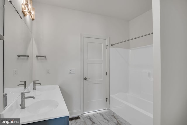 bathroom featuring vanity and shower / washtub combination