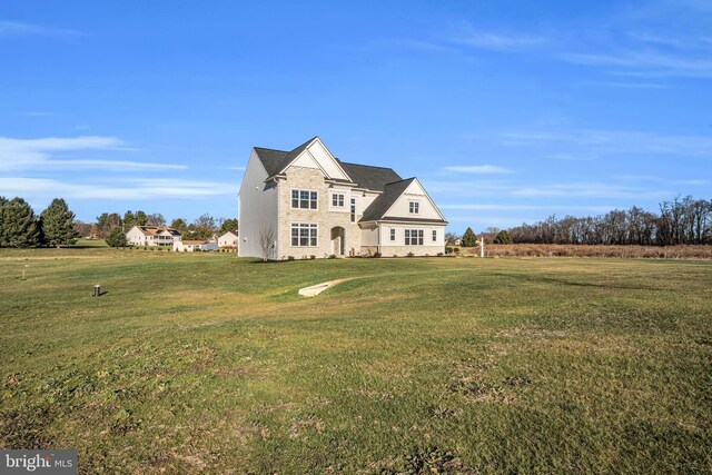 view of front of property with a front lawn