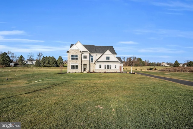 view of front of home with a front lawn