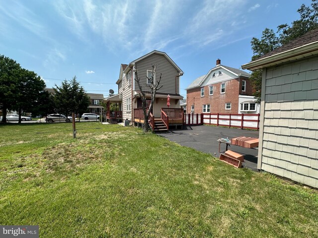 view of yard with a wooden deck