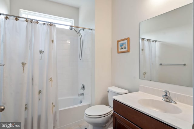 full bathroom featuring shower / bath combo, tile patterned floors, vanity, and toilet