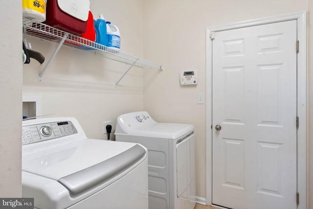 washroom with washer and clothes dryer