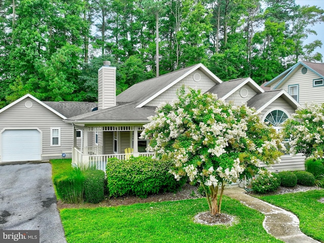 view of front of property featuring a garage and covered porch