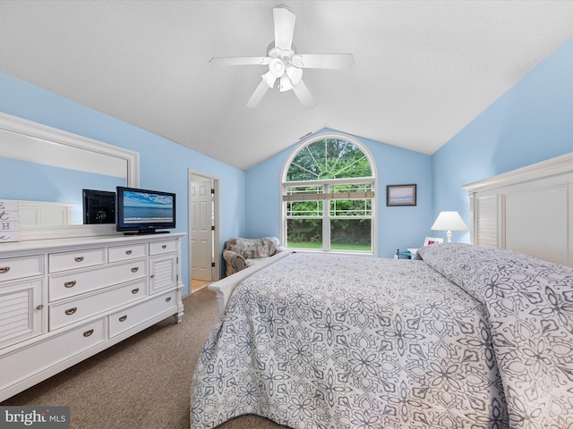 carpeted bedroom with vaulted ceiling and ceiling fan